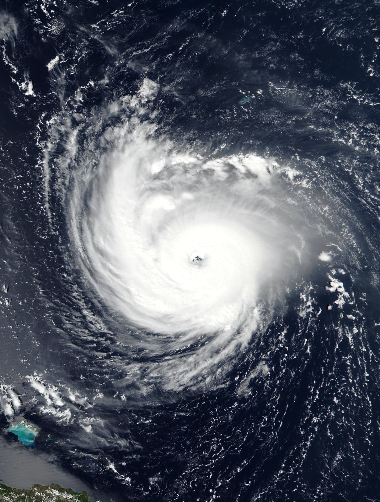 A satellite view of Hurricane Florence over the Atlantic, a clear eye at the centre of a broad spiral of cloud